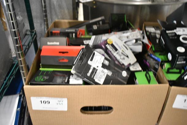 ALL ONE MONEY! Lot of IN ORIGINAL BOX! Items Including Nintendo Joycons, GameStop Dual Charging Dock, GameStop Nintendo Switch Steering Wheel, Nintendo Switch Charger and Game Deck. - Image 2 of 6