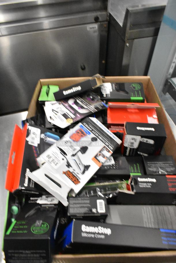 ALL ONE MONEY! Lot of IN ORIGINAL BOX! Items Including Nintendo Joycons, GameStop Dual Charging Dock, GameStop Nintendo Switch Steering Wheel, Nintendo Switch Charger and Game Deck. - Image 3 of 6