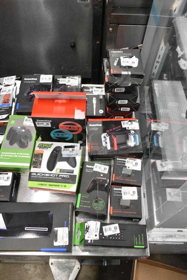 ALL ONE MONEY! Lot of IN ORIGINAL BOX! Items Including Nintendo Joycons, GameStop Dual Charging Dock, GameStop Nintendo Switch Steering Wheel, Nintendo Switch Charger and Game Deck. - Image 5 of 6