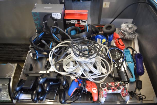 ALL ONE MONEY! Lot of Various Items Including Xbox Controllers, Nintendo Switch Steering Wheel, Headphones and Wiring - Image 1 of 16
