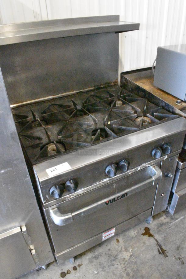 Vulcan 36S-Y1A Stainless Steel Commercial Natural Gas Powered 6 Burner Range w/ Oven, Over Shelf and Back Splash on Commercial Casters. - Image 2 of 8
