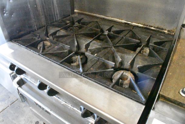 Vulcan 36S-Y1A Stainless Steel Commercial Natural Gas Powered 6 Burner Range w/ Oven, Over Shelf and Back Splash on Commercial Casters. - Image 4 of 8