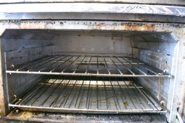 Vulcan 36S-Y1A Stainless Steel Commercial Natural Gas Powered 6 Burner Range w/ Oven, Over Shelf and Back Splash on Commercial Casters. - Image 6 of 8