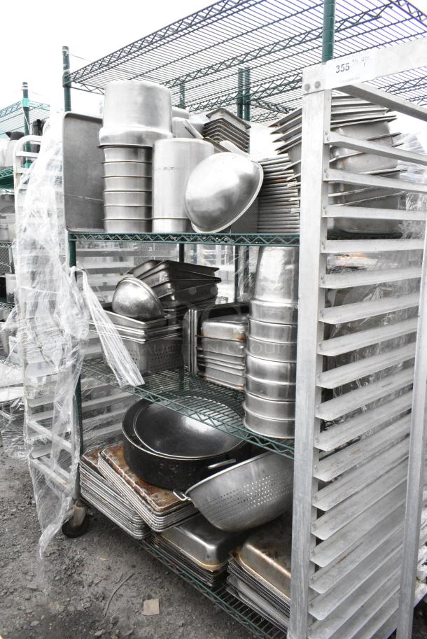 Green Finish 4 Tier Wire Shelving Unit on Commercial Casters w/ Contents Including Stainless Steel Drop In Bins and Metal Baking Pans. BUYER MUST DISMANTLE. PCI CANNOT DISMANTLE FOR SHIPPING. PLEASE CONSIDER FREIGHT CHARGES. - Image 1 of 11