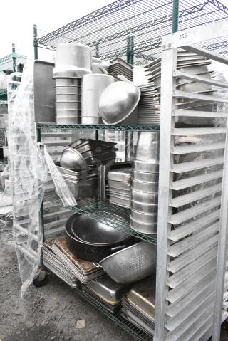 Green Finish 4 Tier Wire Shelving Unit on Commercial Casters w/ Contents Including Stainless Steel Drop In Bins and Metal Baking Pans. BUYER MUST DISMANTLE. PCI CANNOT DISMANTLE FOR SHIPPING. PLEASE CONSIDER FREIGHT CHARGES.