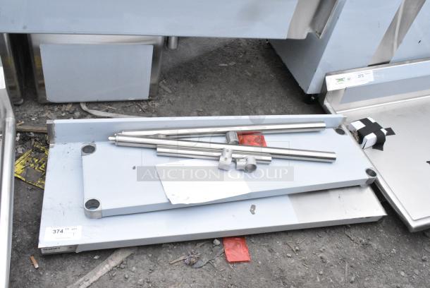 BRAND NEW SCRATCH AND DENT! Regency 600TB1848G 18" x 48" 18-Gauge 304 Stainless Steel Commercial Work Table with 4" Backsplash and Galvanized Undershelf - Image 1 of 5