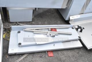 BRAND NEW SCRATCH AND DENT! Regency 600TB1848G 18" x 48" 18-Gauge 304 Stainless Steel Commercial Work Table with 4" Backsplash and Galvanized Undershelf