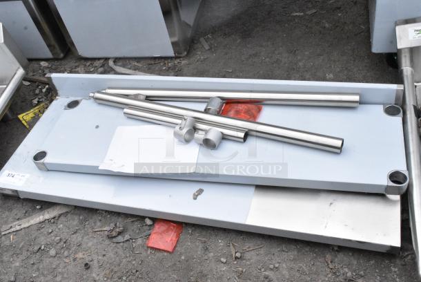 BRAND NEW SCRATCH AND DENT! Regency 600TB1848G 18" x 48" 18-Gauge 304 Stainless Steel Commercial Work Table with 4" Backsplash and Galvanized Undershelf - Image 2 of 5