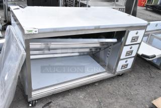 BRAND NEW SCRATCH AND DENT! Regency 600EBT3060R 30" x 60" 16 Gauge Type 304 Stainless Steel Enclosed Base Sliding Door Table with Drawers on Commercial Casters