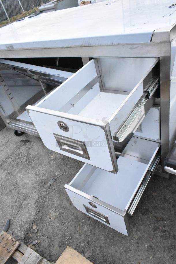 BRAND NEW SCRATCH AND DENT! Regency 600EBT3060R 30" x 60" 16 Gauge Type 304 Stainless Steel Enclosed Base Sliding Door Table with Drawers on Commercial Casters - Image 4 of 5