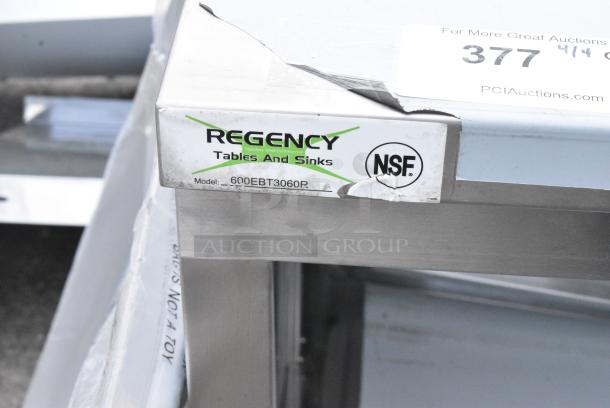 BRAND NEW SCRATCH AND DENT! Regency 600EBT3060R 30" x 60" 16 Gauge Type 304 Stainless Steel Enclosed Base Sliding Door Table with Drawers on Commercial Casters - Image 5 of 5