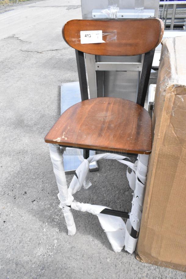 BRAND NEW SCRATCH AND DENT! Black Metal Bar Height Chair w/ Wooden Back Rest and Seat. - Image 1 of 3