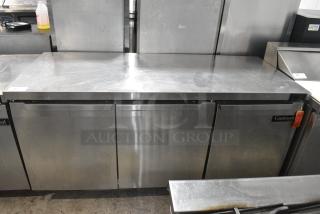 2017 Continental SW72 Stainless Steel Commercial 3 Door Work Top Cooler on Commercial Casters. 115 Volts, 1 Phase. Tested and Working!