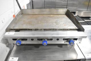 Imperial Stainless Steel Commercial Countertop Natural Gas Powered Flat Top Griddle.