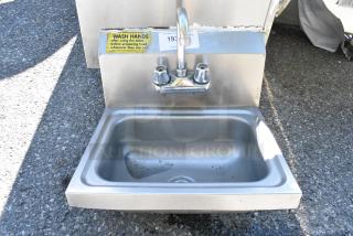Stainless Steel Single Bay Wall Mount Sink w/ Faucet and Handles.