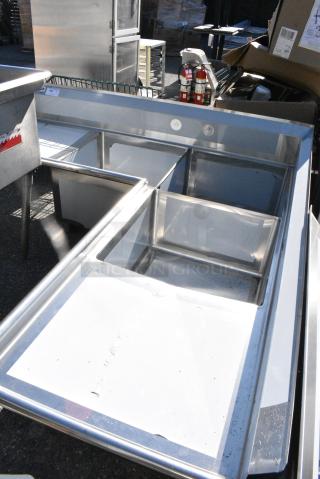 BRAND NEW SCRATCH AND DENT1`Regency 600S3242424C Stainless Steel 3 Bay L Shaped Sink w/ Dual Drain Boards. No Legs.