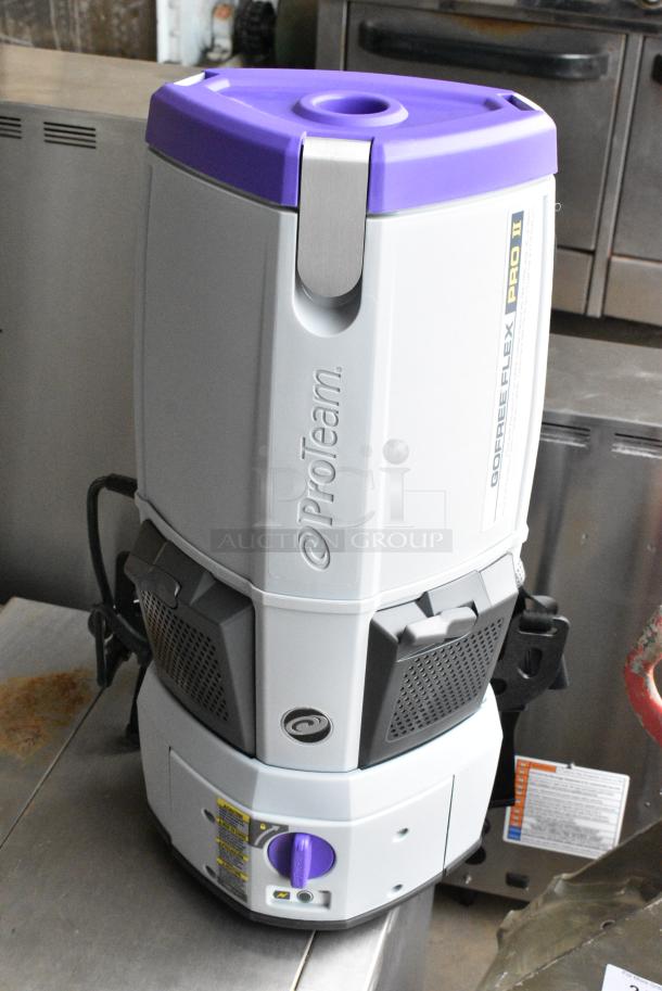BRAND NEW SCRATCH AND DENT! ProTeam 107644 GoFree Flex Pro II 12 Ah 6 Qt. Cordless Backpack Vacuum with Xover Multi-Surface Telescoping Wand Tool Kit 196107644. Tested and Working! - Image 1 of 8