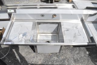 BRAND NEW SCRATCH AND DENT! Regency 600S11818218 54" 16 Gauge Stainless Steel One Compartment Commercial Sink with Galvanized Steel Legs and 2 Drainboards - 18" x 18" x 14" Bowl. No Legs.