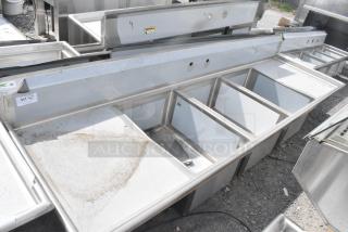 BRAND NEW SCRATCH AND DENT! Regency 600S32028224 115" 16-Gauge Stainless Steel Three Compartment Commercial Sink with 2 Drainboards - 20" x 28" x 14" Bowls. No Legs.