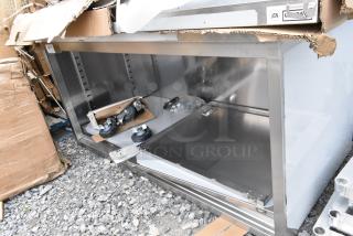BRAND NEW SCRATCH AND DENT! Regency 600EBT3060D 30" x 60" 16 Gauge Type 304 Stainless Steel Enclosed Base Table with Sliding Doors and Adjustable Midshelf