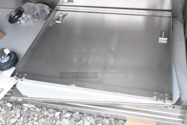 BRAND NEW SCRATCH AND DENT! Regency 600EBT3060D 30" x 60" 16 Gauge Type 304 Stainless Steel Enclosed Base Table with Sliding Doors and Adjustable Midshelf - Image 2 of 4
