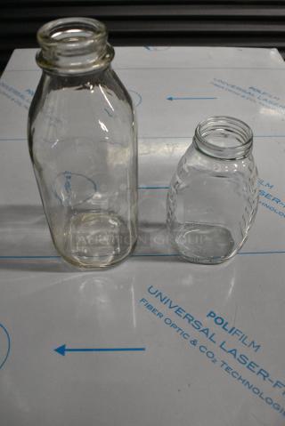 2 BRAND NEW SCRATCH AND DENT! Boxes of Jars Including 500GJHCL16 12 oz. (16 oz. Honey Weight) Classic Queenline Glass Honey Jar - 12/Case and Libbey 92129 33.5 oz. Glass Milk Bottle - 24/Case. 2 Times Your Bid!