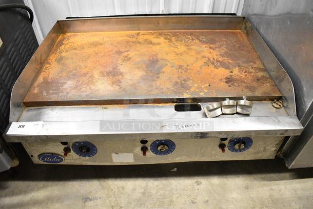 Globe Stainless Steel Commercial Countertop Natural Gas Powered Flat Top Griddle w/ Thermostatic Controls. - Image 1 of 7