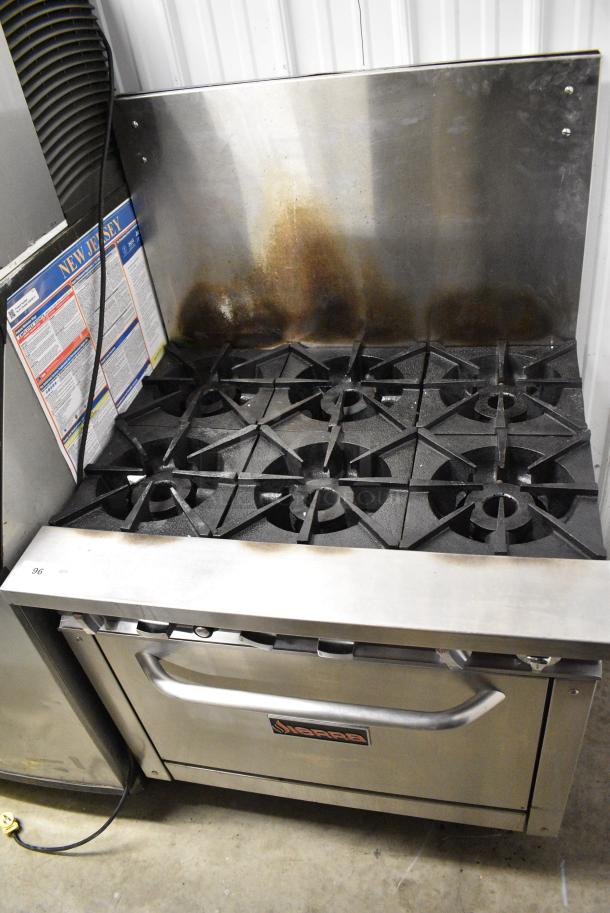 Sierra Stainless Steel Commercial Natural Gas Powered 6 Burner Range w/ Oven and Back Splash. - Image 1 of 10