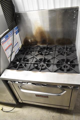 Sierra Stainless Steel Commercial Natural Gas Powered 6 Burner Range w/ Oven and Back Splash.