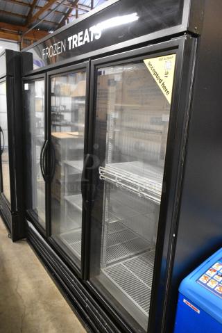 2016 True GDM-72F-HC Metal Commercial 3 Door Reach In Freezer Merchandiser w/ Poly Coated Racks. 115/208-230 Volts, 1 Phase. Tested and Working!