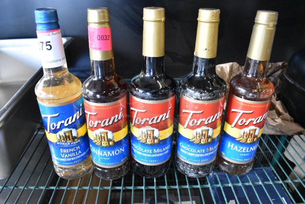 5 BRAND NEW SCRATCH AND DENT! Bottles of Torani Flavor Including Hazelnut, Chocolate Milano, Cinnamon and French Vanilla. 5 Times Your Bid! - Image 1 of 4