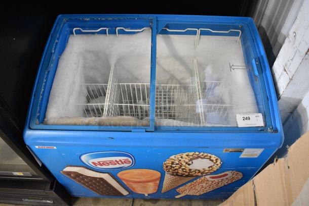 AHT RIO S 100 Metal Commercial Chest Freezer Merchandiser on Commercial Casters. See Pictures for Broken Glass. 115 Volts, 1 Phase. Tested and Working! - Image 1 of 8
