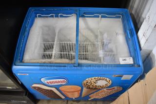 AHT RIO S 100 Metal Commercial Chest Freezer Merchandiser on Commercial Casters. See Pictures for Broken Glass. 115 Volts, 1 Phase. Tested and Working!