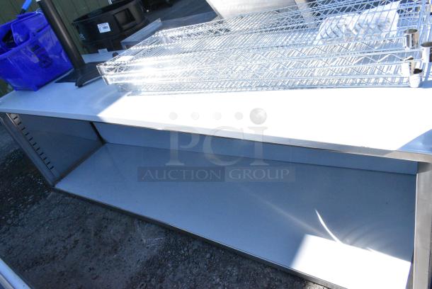 BRAND NEW SCRATCH AND DENT! Regency 600EBT3096 30" x 96" 16 Gauge Type 304 Stainless Steel Enclosed Base Table with Open Front and Adjustable Midshelf - Image 2 of 4