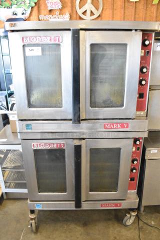 2 Blodgett Mark V Stainless Steel Commercial Electric Powered Full Size Convection Oven w/ View Through Doors, Metal Oven Racks and Thermostatic Controls on Commercial Casters. 250 Volts, 3 Phase. 2 Times Your Bid!