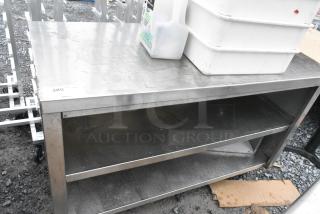 Stainless Steel Counter w/ 2 Under Shelves on Commercial Casters.