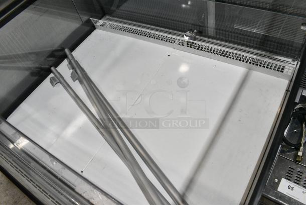 BRAND NEW SCRATCH AND DENT! Econocold OM-IRSSCG Metal Commercial Floor Style Self Contained Island Fridge Curved Glass on Commercial Casters. 115 Volts, 1 Phase. Tested and Working! - Image 4 of 10