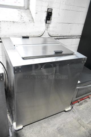 Master-Bilt DC-4D Stainless Steel Commercial Chest Freezer on Commercial Casters. 115/208-230 Volts, 1 Phase. Tested and Working!