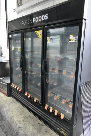 2016 True GDM-72F-HC Metal Commercial 3 Door Reach In Freezer Merchandiser w/ Poly Coated Racks. 115/208-230 Volts, 1 Phase. Tested and Working!