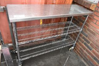 Stainless Steel Table w/ 2 Wire Shelves on Commercial Casters.