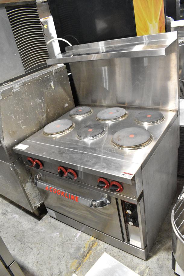 BRAND NEW SCRATCH AND DENT! Cookline Stainless Steel Commercial 6 Burner Electric Powered Hot Plate Range w/ Oven and Back Splash. 240 Volts, 3 Phase. - Image 1 of 15