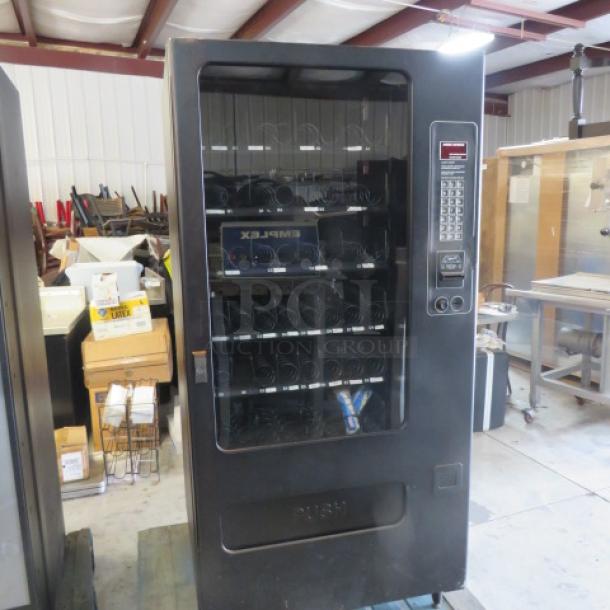 One FSI Snack Vending Machine With Key. Model# 3129. 115 Volt.  35X35X72. - Image 1 of 3