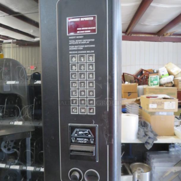 One FSI Snack Vending Machine With Key. Model# 3129. 115 Volt.  35X35X72. - Image 2 of 3
