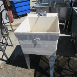 One Utility Sink With faucet.