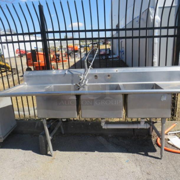One Stainless Steel 3 Compartment Sink With R/L Drain Boards, Back Splash And Faucet With Hose Sprayer. 103X34X43. Sink 20X28X12. - Image 1 of 2