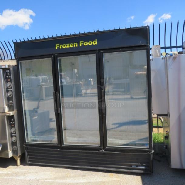 One 3 Door True Glass Door Display Freezer With 9 Racks. Unable To Test. Model# GDM-72F-LD. 115/208-230 Volt. 1 Phase. 78X31X78. $6075.13. - Image 1 of 2