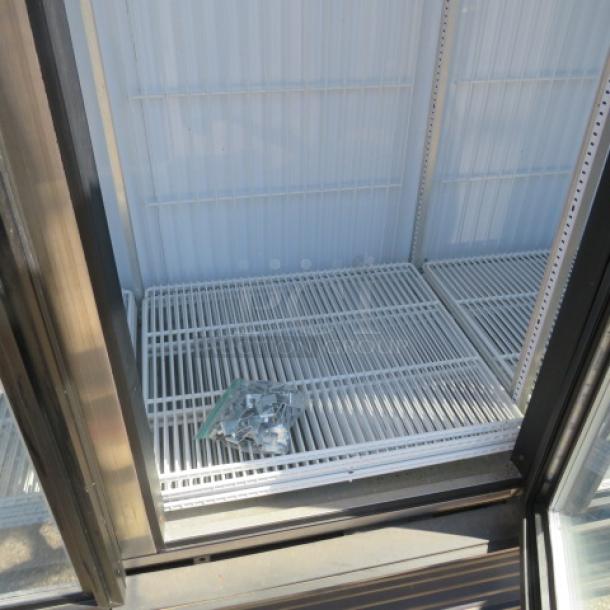One 3 Door True Glass Door Display Freezer With 9 Racks. Unable To Test. Model# GDM-72F-LD. 115/208-230 Volt. 1 Phase. 78X31X78. $6075.13. - Image 2 of 2