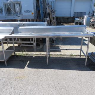 One Stainless Steel Table With Back Splash. 90X30X43