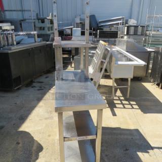 One Stainless Steel Table With 2 SS Over Shelves, 2 SS Under Shelves And 6 Hooks. 42X16X68