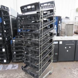 One Metal Rack With 9 Poly Racks On Casters. 23X32X73
